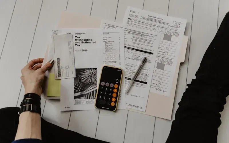 Financial services agent reviewing client records with a customer