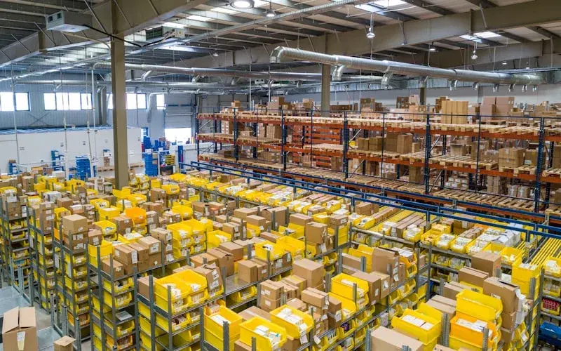 Logistics supervisor tracking a distributed delivery team on a route map